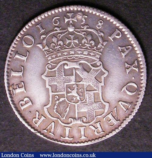 London Coins : A142 : Lot 2738 : Shilling 1658 Cromwell ESC 1005 with a slight flattening to the rim at 5 and 7 o'clock on the re...