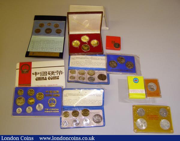 China Mint Sets 1980 (2) both 7 coin sets and in the original strip plastic presentation wallet with certificate and denomination list one in blue one in black, Proof Set 1985 7 coins with cow medal in the perspex holder with blue inset this in red and white outer card envelope, COINS COMMEMORATING THE CENTENNIAL BIRTHDAY OF DR. SUN YAT-SEN 4 coins set (2 in silver) in perspex holder, 5 Yuan 1992 Marco Polo Silver Proof, Medallic issues 50th Anniversary of Founding of Republic of China silver 34mm in perspex holder, 3 coin base metal set 1949 - 1984 in perspex holder, 4 coin brass GUILIN CHINA 1949 - 1979 in the wooden box with Forbidden City on the lid, 5th Anniversary of Far East Exchange boxed, Republic of Korea Mint Set Seoul 8 - 11 -1985 6 coin set in black velvet presentation case, generally Unc - FDC as issued : World Bulk Lots : Auction 143 : Lot 1213