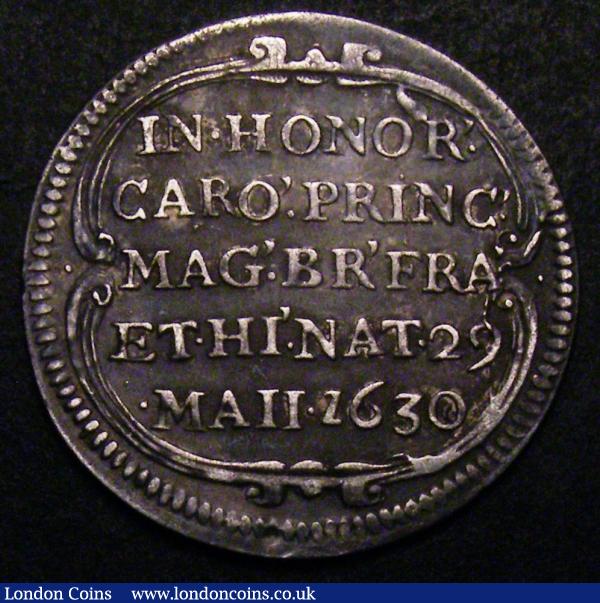 Birth of Prince Charles (King Charles II) 1630 30mm diameter in silver  Eimer 116 Obverse four oval shields united at the centre at their bases, radiate, HACTENVS. ANGLORVM. NVLLI Reverse IN.HONOR' CARO' . PRINC'. MAG'. BRI'. FR'. ET.HI'. NAT'. 29. MAII 1630 within a decorative frame GVF/VF : Medals : Auction 148 : Lot 1012