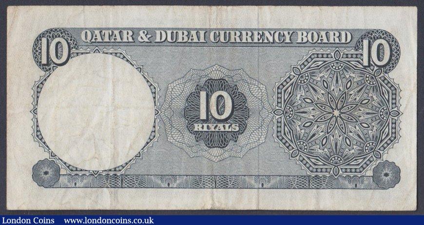 London Coins : A151 : Lot 464 : Qatar & Dubai 10 riyals issued 1960s series A/2 676737, Pick3a, good Fine