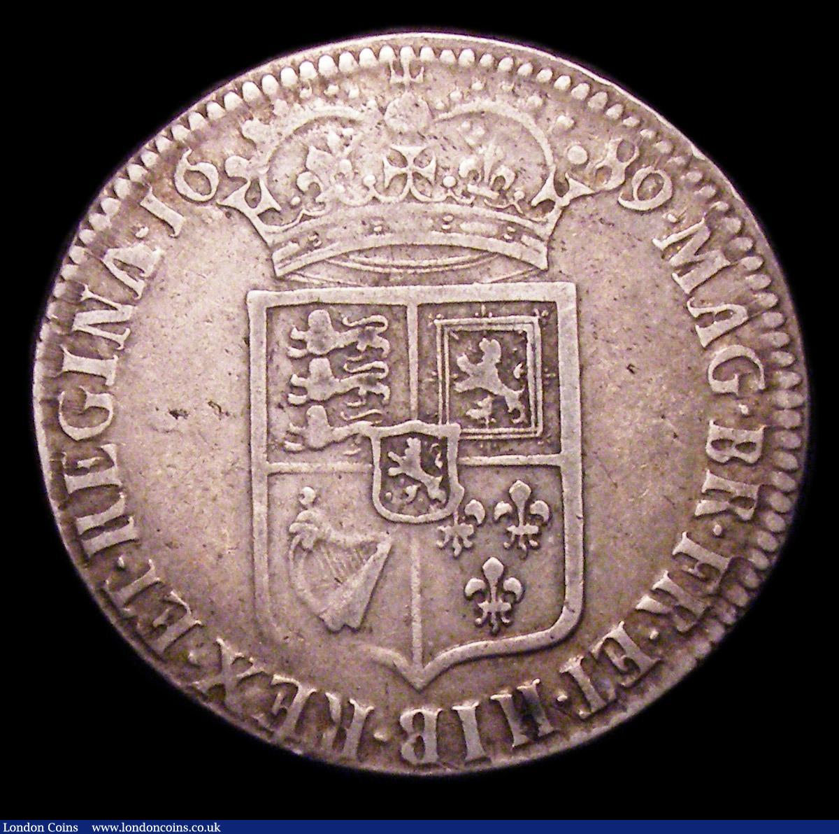 London Coins : A153 : Lot 2216 : Halfcrown 1689 First Shield, No Frosting, with pearls ESC 507 Good Fine/Fine