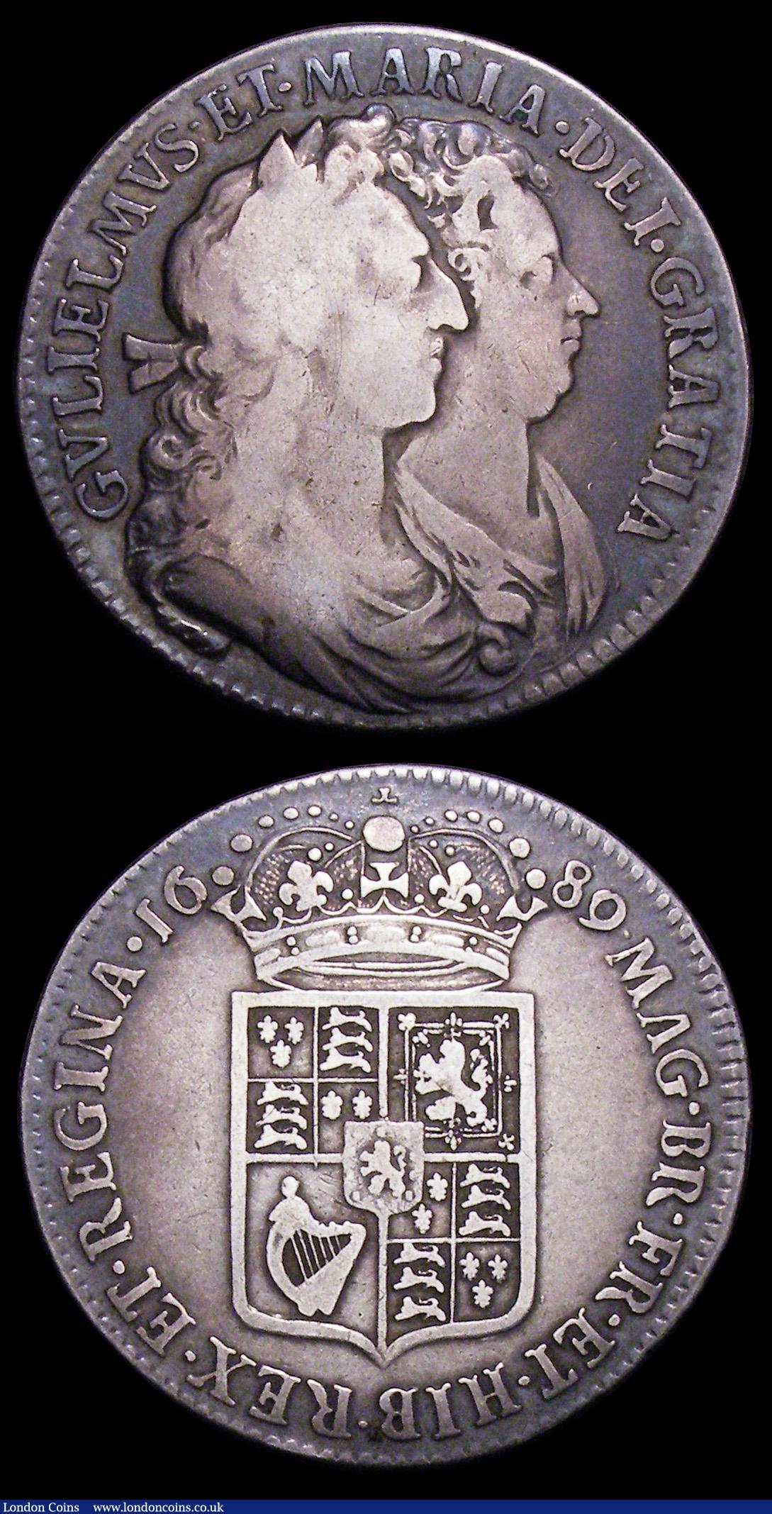 London Coins : A155 : Lot 1050 : Halfcrowns 1689 (2) First Shield, Caul only frosted, with pearls, ESC 505 Good Fine/Fine, Second Shi...