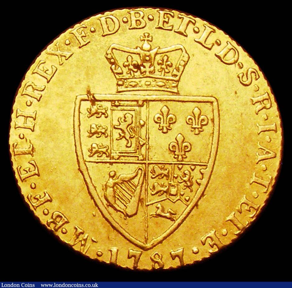 London Coins : A157 : Lot 2237 : Guinea 1787 S.3729 NVF/VF with a small flan flaw on the rim of the shield, the obverse slightly weak...
