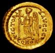 London Coins : A157 : Lot 1709 : Anastasius.  Au solidus.  C, 498-518 AD.  Rev;  VICTORIA AVGGG I; Victory standing left, holding lon...