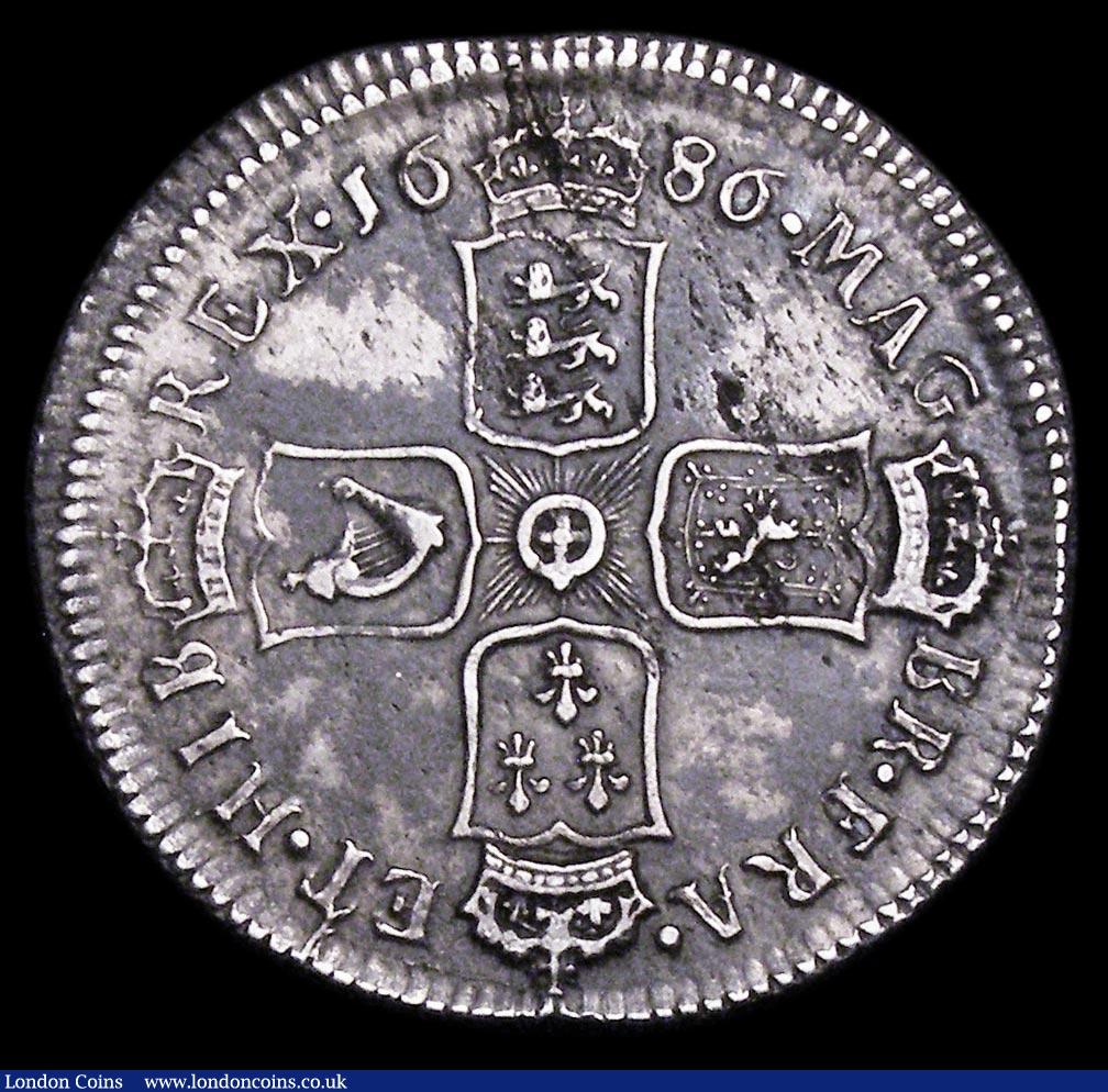 London Coins : A158 : Lot 2420 : Shilling 1686 ESC 1070 NVF with some haymarking, the reverse with uneven toning 