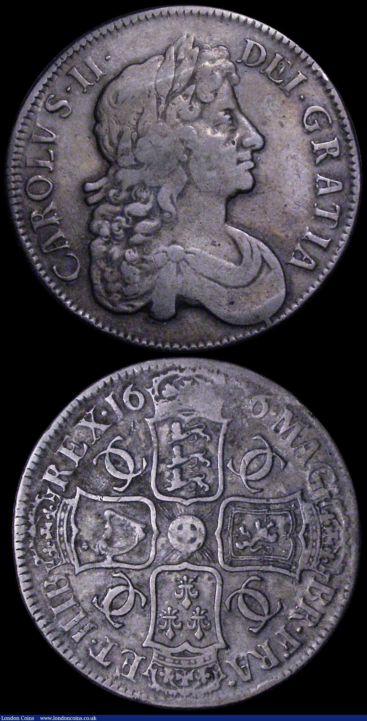 London Coins : A162 : Lot 1742 : Crowns (2) 1662 No Rose below bust, No edge date ESC 19, Bull 347 VG, 1676 ESC 51, Bull 397 About Fi...