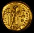London Coins : A162 : Lot 2059 : Byzantine. Gold Solidus Justinian I (527-565AD) struck 527-538AD, Constantinople Mint. Obverse: Helm...
