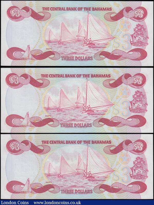 Bahamas (3) a high grade, about UNC - UNC, consecutively numbered trio of the QE2 portrait 3 Dollars Pick 44 Law of 1974 (1984) signature William C. Allen (3) serial numbers A637426 - A 637428. Each note in red on multicolour with the QE2 portrait at right and beach scene at left on obverse. The reverse with an illustration of sailing Regatta boats. Watermarked with a ship and a fabulous Thomas De La Rue prints. : World Banknotes : Auction 170 : Lot 136