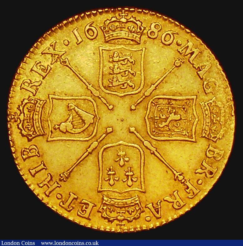 London Coins : A173 : Lot 1699 : Guinea 1686 First Bust S.3400 VF and with a pleasing and even strike, many James II Guineas are enco...
