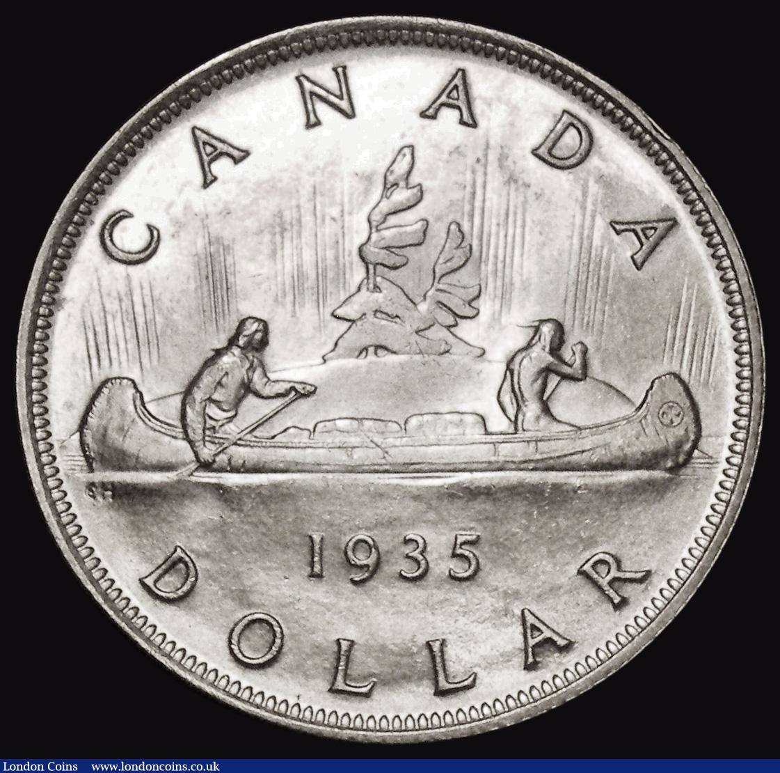 London Coins : A176 : Lot 865 : Canada Dollar 1935 KM#30 UNC or near so and lustrous with some small edge nicks and some light tonin...