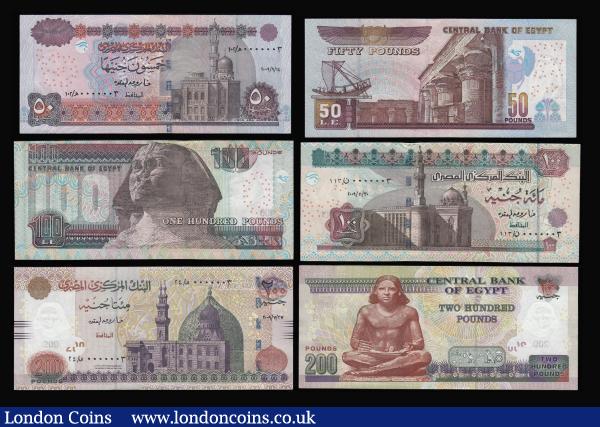 Egypt - Central Bank of Egypt (7) a group of Royal issues all with serial number 0000004 as follows:  Two Hundred Pounds 2009 issue Pick 69a (Signature 22) dated 2009/7/27 a small crease on the left of the top edge, otherwise UNC, One Hundred Pounds 2009 issue (Signature 22) dated 2009/11/30 Pick 67 counting flicks on the top edge otherwise UNC, Fifty Pounds 2009 issue (Signature 22) Pick 66 dated 2009/9/14 UNC, Twenty Pounds 2009 issue (Signature 22) Pick 65 dated 2009/8/13 UNC, Ten Pounds 2009 issue (Signature 22) Pick 64 dated 2009/4/29 Five Pounds 2008 issue (Signature 22) Pick 63 dated 2008/9/4 a small crease on the top edge otherwise UNC, One Pound 2017 issue Pick 71 (signature 24) dated 2017/11/28 UNC : World Banknotes : Auction 176 : Lot 156