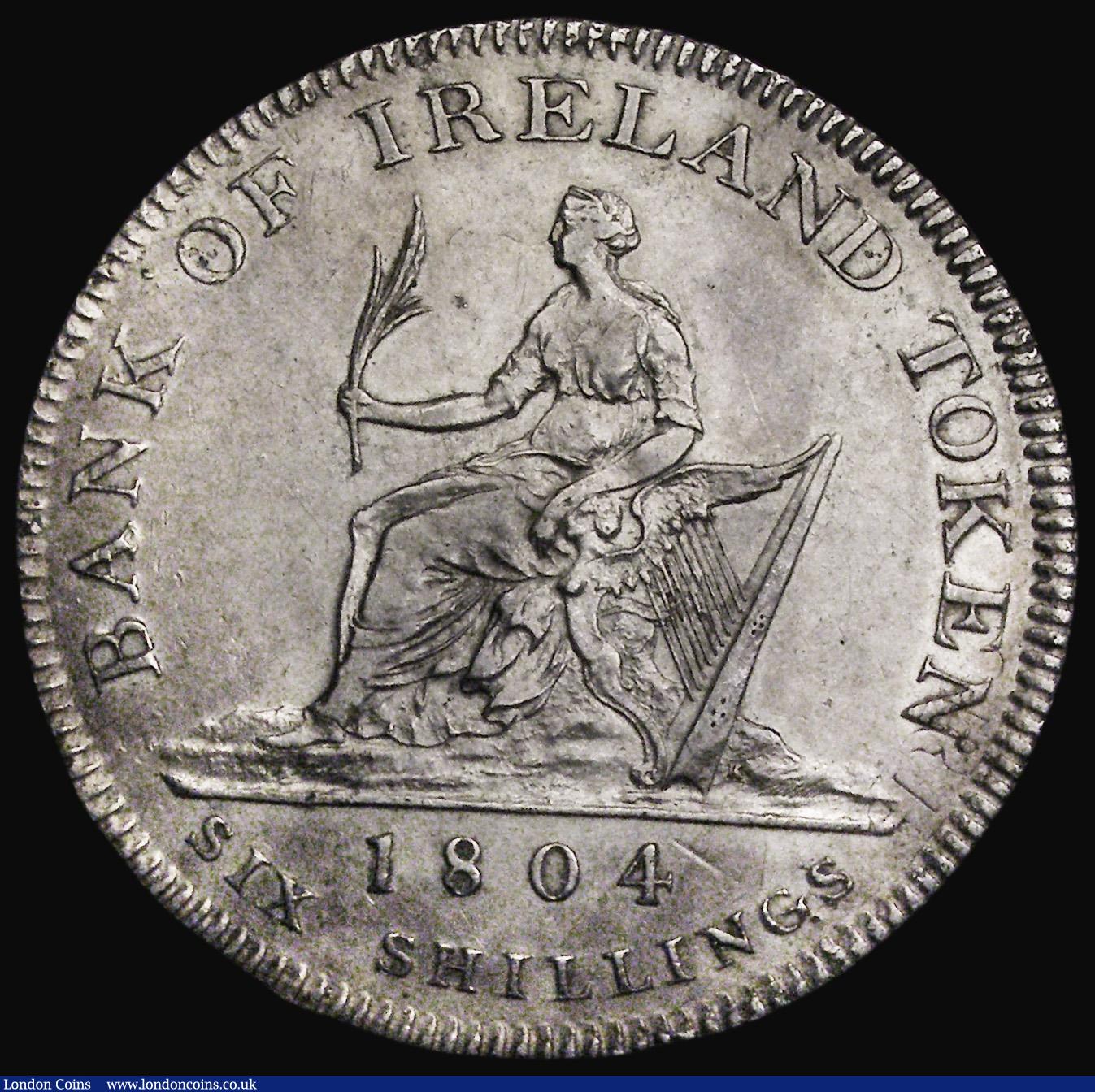 London Coins : A188 : Lot 884 : Ireland Six Shilling Bank Token 1804 S. Good Fine or better, the obverse with some flan flaws and sc...