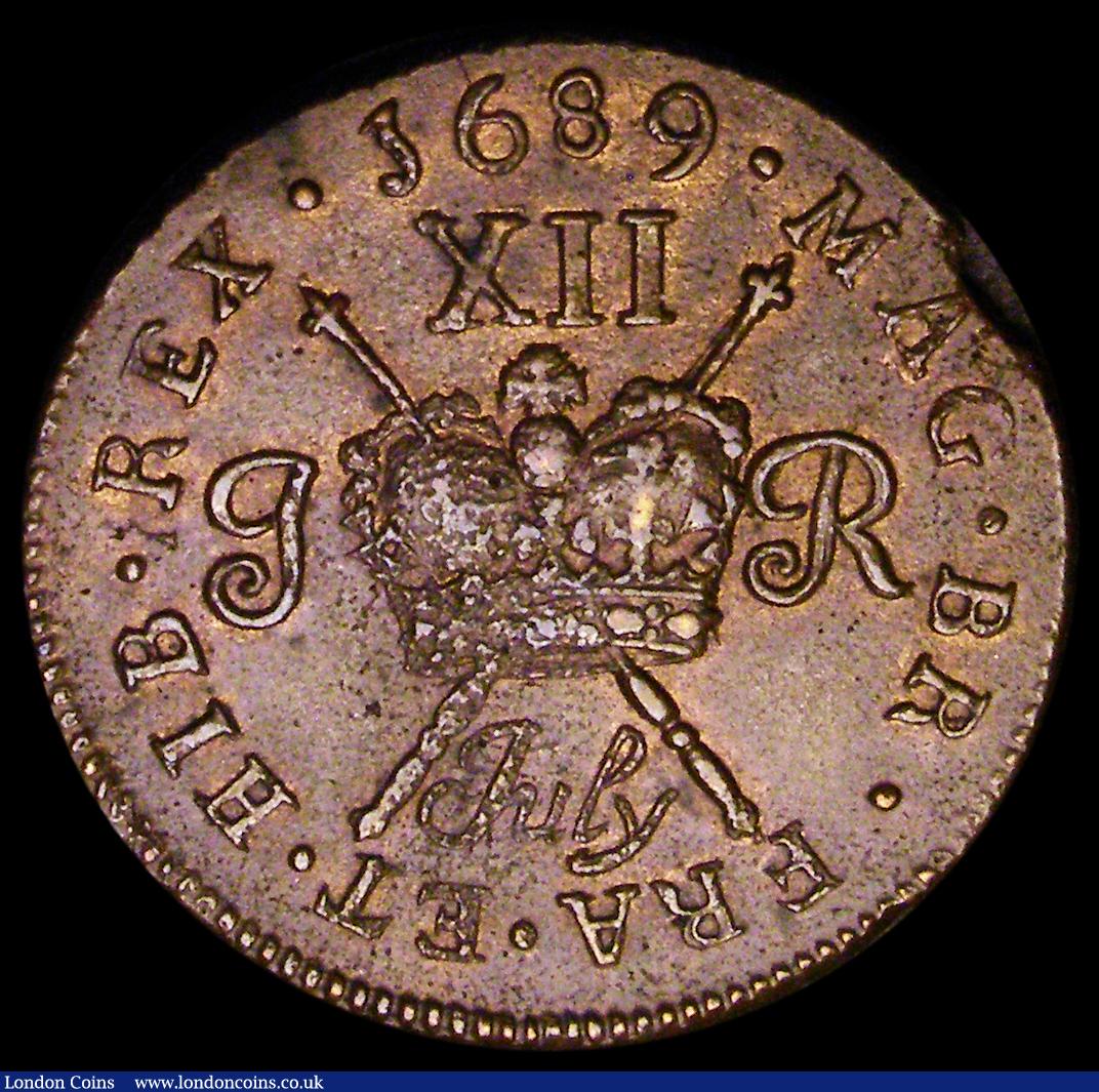 London Coins : A189 : Lot 1044 : Ireland Shilling Gunmoney 1689 July S.6581A, Timmins TB12B-1A GVF with a planchet flaw at the edge b...