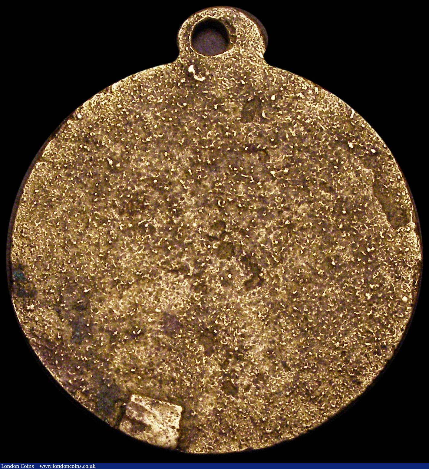 London Coins : A189 : Lot 702 : Iran, a hand-engraved medal dated 2064, uniface in brass, 41mm diameter, an incuse design of crossed...
