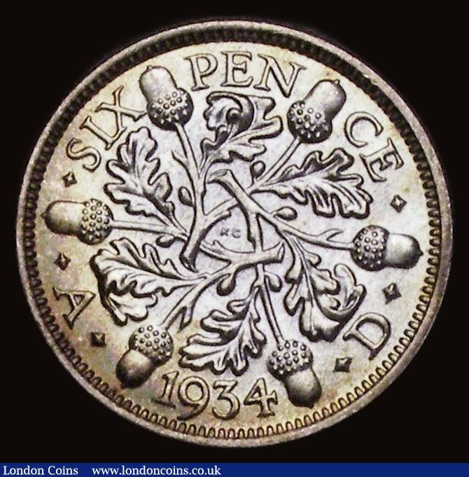 London Coins : A191 : Lot 2034 : Sixpence 1934 ESC 1823, Bull 3915 Choice UNC with original mint brilliance and some peripheral gold ...