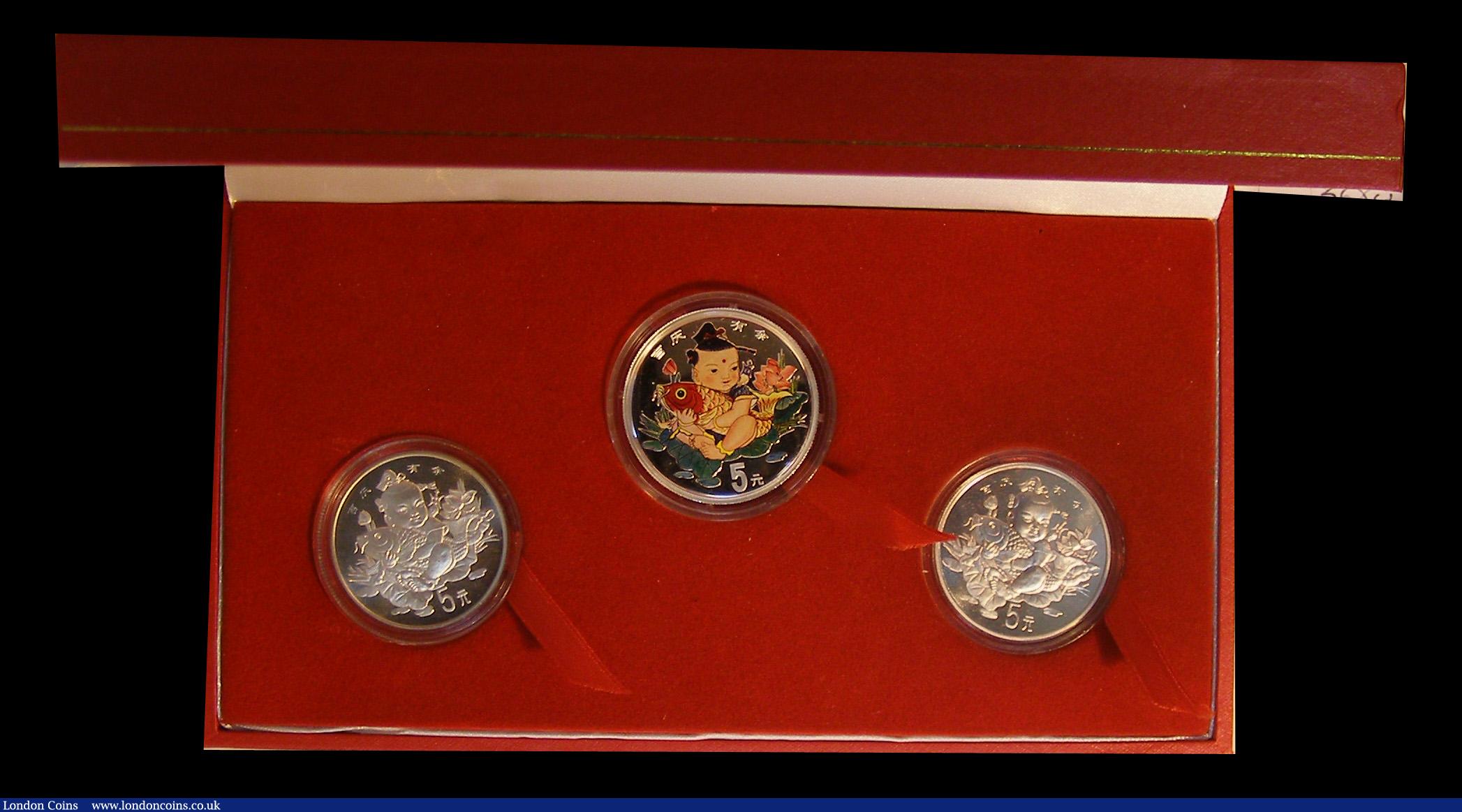 London Coins : A191 : Lot 589 : China Lucky Silver Coin Set 1997 containing 3 silver 5 Yuan one with a coloured reverse and this dou...
