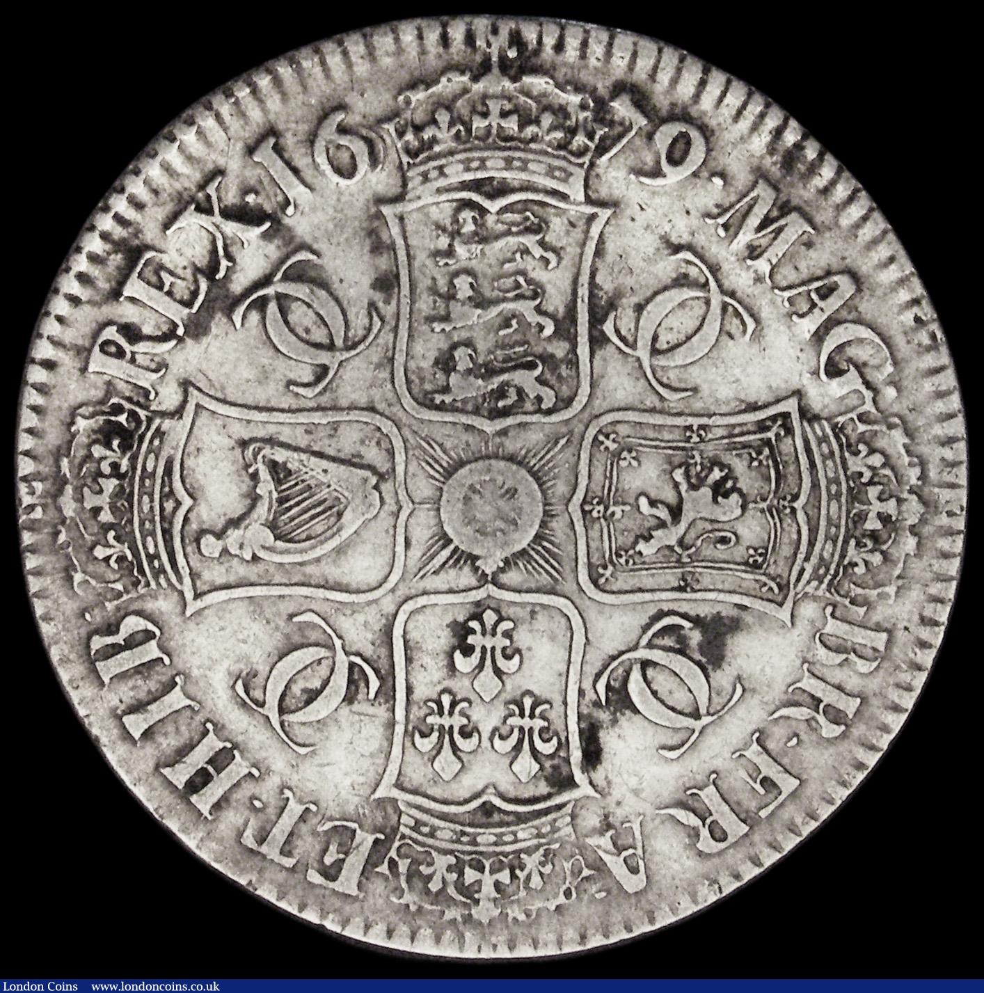 London Coins : A193 : Lot 1085 : Crown 1679 Third Bust TRICESIMO PRIMO edge ESC 56, Bull 403 bright and bold Fine with some uneven bl...