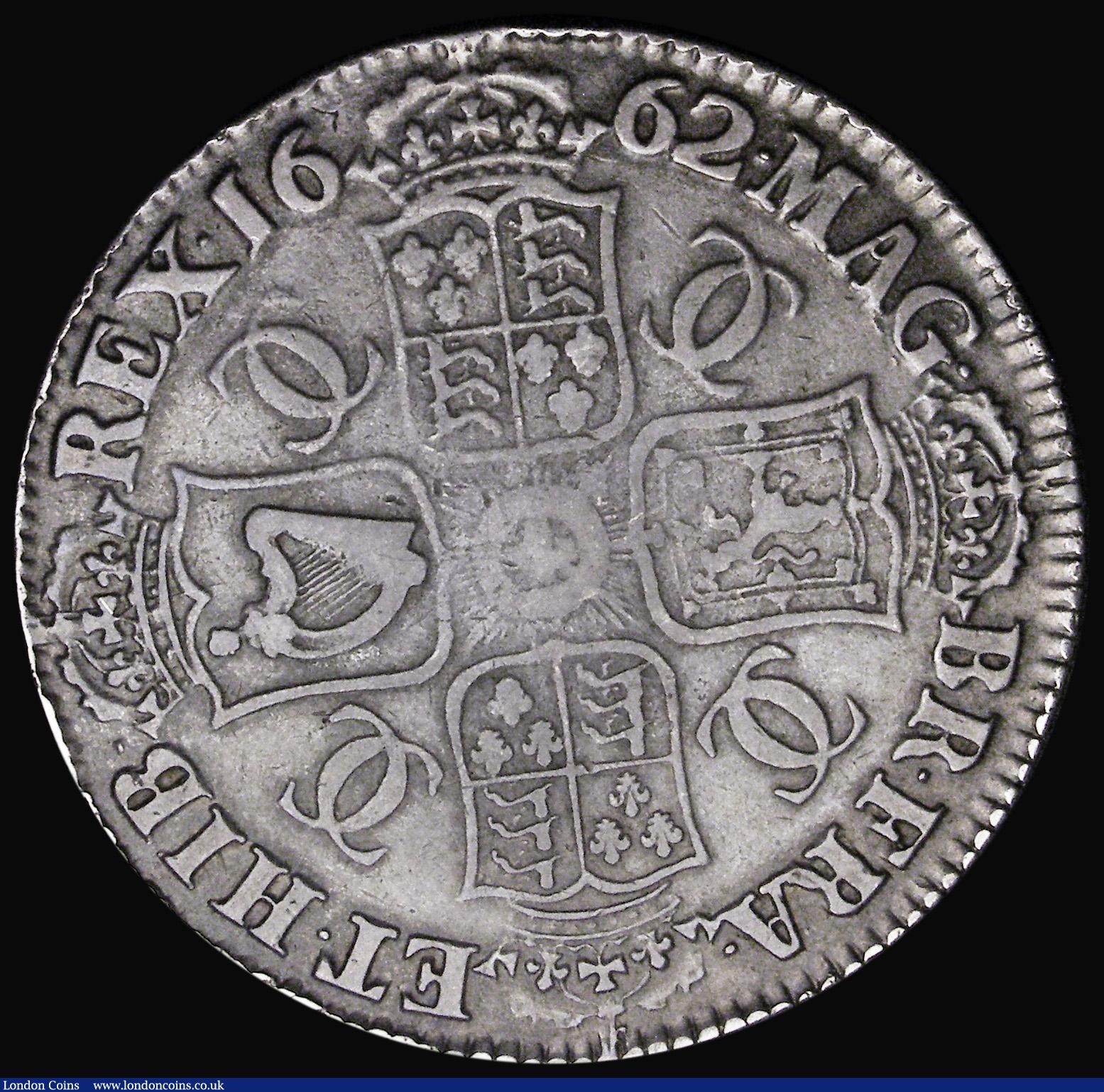 London Coins : A194 : Lot 1080 : Crown 1662 First Bust Rose below, 10 harps strings edge weak in parts with DECVS and TUTAMEN clear t...