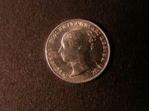 London Coins : A124 : Lot 1002 : Threepence 1859 ESC 2066 UNC with a small rim flaw at 9 o'clock on the obverse caused in the strikin...