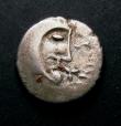 London Coins : A145 : Lot 1211 : Unit Ar. Iceni.  Boudicca type.  C, 61 AD.  Obv; Celticized head r.  Rev; Horse r, wheel object abov...