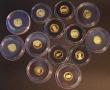 London Coins : A180 : Lot 725 : World in Gold - The Smallest Gold Coins of the World 2007-2010 a 24-coin set, includes examples from...
